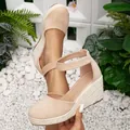 Elegant beige closed-toe wedge sandals with woven espadrille platform and ankle strap - 38 / Apricot