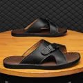 Men's black leather cross-strap slide sandals with adjustable buckle and soft brown sole - 38 / Black
