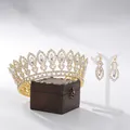 Elegant gold baroque bridal tiara and earrings set displayed on a vintage wooden box. - Crown And Earrings Set / 18K Gold Base White Stone White Glass (With Earrings)