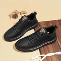 Men's stylish black leather casual sneakers featuring a soft sole and mid-top design - 38 / Black