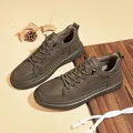Fashionable men's leather sneakers featuring soft soles and a vintage olive green finish - Khaki