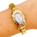 Close-up of ladies gold-tone watch with unique shell case and lavender dial - 5460-Gold Purple