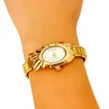 Close-up of a women's gold-tone fashion watch with unique stylized casing on wrist - 5461-Gold White