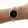 Detail view of a minimalist silver steel strap ladies quartz watch with a black numeric dial - Modular Numeric Round Style (4672) / Black