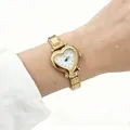 Detailed view of a gold-toned heart-shaped quartz watch with modular stainless steel strap - Gold Modular Heart White (5521) / Gold