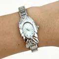 Close-up view of a unique women's fashion watch featuring a silver fish-shaped case - 5471-Silver Green