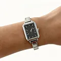 Elegant rectangular quartz watch for women featuring a silver stainless steel band on wrist - Silver Starry Black