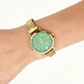 Vintage gold stainless steel modular watch with textured green dial worn on a person's wrist - Gold Green Dial Modular Watch(4616) / Gold