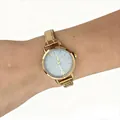 Detailed view of an elegant gold stainless steel modular watch worn on a wrist showing the glitter dial - Gold Cream Dial Modular Watch(4617) / Gold