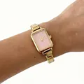 Close-up shot of an elegant women's gold steel watch featuring a soft pink dial - Soft Pink Style (4644) / Gold Square Dial Pink
