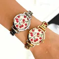 Close-up of stylish women's quartz watches with cherry pattern dials and gold/silver bands. - Round Cherry Modular Style (5156) / Silver