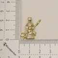 Detailed view of a gold-plated Monkey King pendant with sparkling crystals on a ruler - Monkey King Style (4)