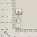 Close-up of a stainless steel Italian modular charm featuring a cute blue skateboard dangle. - Cartoon Skateboard Charm (Single 1)