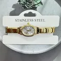 Close-up of elegant gold-toned women's quartz watch with oval dial and link band. - Small Round Dial Modular Style (5143) / Gold