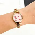 Detailed view of women's quartz watch featuring pink strawberry dial and cherry band - Round Strawberry Modular Style (5153) / Gold