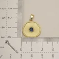 Gold stainless steel round pendant with blue stone on a centimeter measurement grid - Radial Texture Blue Gem Style (10)