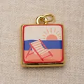 Macro view of square gold-framed copper pendant featuring a colorful beach sunset illustration - Beach Sunset Style (3) / Blue/Pink (Beach Sunset)