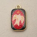 Detail macro view of a rectangular vintage copper pendant with a white bird illustration. - Rectangular Flying Dove Style (13)