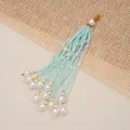 Elegant light blue beaded tassel pendant with white pearls and golden accents - Light Blue