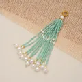 Elegant long mint green bead tassel pendant decorated with white pearls and gold loop - Green