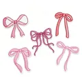 Close-up detail of five assorted pink embroidered bow patches for clothing and DIY decor. - Pink Bowknot Set A / 5 Pieces