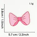 Detailed view of pink bow embroidered patch with 5.7x3.8cm measurement for DIY craft - Pink Bow Style 16 (Gradient)