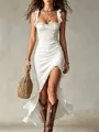 Detail view of a sexy white ruched sleeveless dress featuring a high side slit - S / Dresses / White