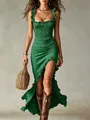 Detailed view of a green ruffled maxi dress with a sexy high-side slit and elegant ruffles - Green