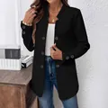 Detail shot of black textured blazer featuring decorative buttons and ribbed pattern. - S / Tops / Black