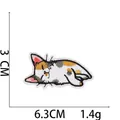 Detailed view of a cute sleeping calico cat embroidered iron-on patch, size 6.3x3cm - Lying Calico Cat Style (7#) / 6.3x3cm