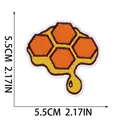 Close-up of honeycomb embroidered patch showing 5.5cm size and dripping honey design - Dripping Honeycomb (W18MF-08-09) / 5.5x5.5cm