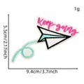 Detailed view of embroidered paper airplane patch with 'Keep going' text and dimensions. - Keep Going Paper Plane Style (19#)