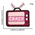 Detail view of a pink cartoon TV embroidered patch with dimensions and weight info. - Crazy Pink TV Style (24#)