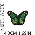 Detail showing exact dimensions of the green butterfly embroidered patch. - Green Yellow Butterfly (X19HD-05-01) / 4.3x3.2cm
