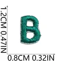 Detail view of a mini green embroidered letter B patch showing 1.2cm height and 0.8cm width - Letter B (Green)