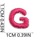 Detailed macro view of a mini pink embroidered letter G patch with size dimensions - Letter G