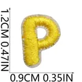 Macro view of mini yellow embroidered letter P patch with clear size dimensions - Letter P