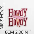 Close-up of embroidered pink surf girl patch with Howdy text, measuring 6cm x 5.7cm - Surfing Girl Howdy (C20HG-095-02)