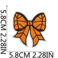 Detailed view of basketball themed bow embroidered patch with 5.8cm dimensions - Basketball Bowknot Patch (C22LQ-125-15)