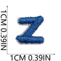 Detailed macro view of a blue embroidered letter Z patch showing 1cm square dimensions - Letter Z