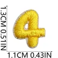 Close-up detail showing dimensions of yellow number 4 mini embroidered patch patch - Number 4