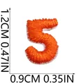 Detailed view of a mini orange number 5 embroidered patch for DIY craft projects - Number 5