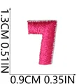 Close-up detail showing 1.3cm height measurements for pink embroidered number 7 patch - Number 7