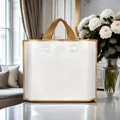 Large white and gold reusable shopping bag presented in a luxury interior room - White Gold Edge / Small 14 Silk 30*25 Bottom 6CM (Pack of 10)