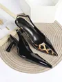 Close-up detail of leopard print and black patent leather slingback pointed-toe heels - 34 / Black Leopard