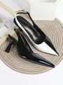 Detailed view of two-tone black and white pointed toe slingback high heel shoes - 34 / Black and White