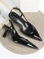 Detailed view of elegant black patent leather slingback heels with pointed toe design - Black Patent Leather