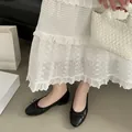 Elegant black round toe ballet flats with delicate bow detail and soft leather finish - 35 / Black