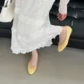 Elegant yellow round-toe ballet flats featuring a delicate bow detail in soft leather finish - 35 / Yellow