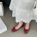 Elegant red faux leather ballet flats featuring a round toe and delicate bowknot detail - Burgundy